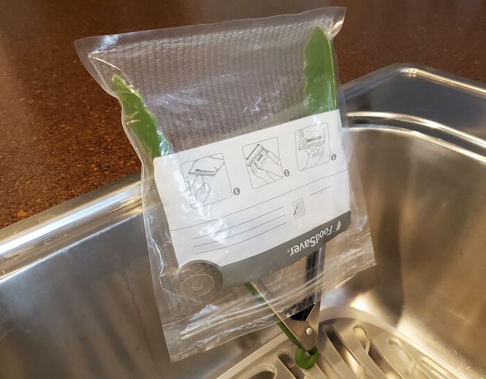 Vacuum-sealed vegetables hanging to keep fresh using a genius life hack for food storage and preservation.