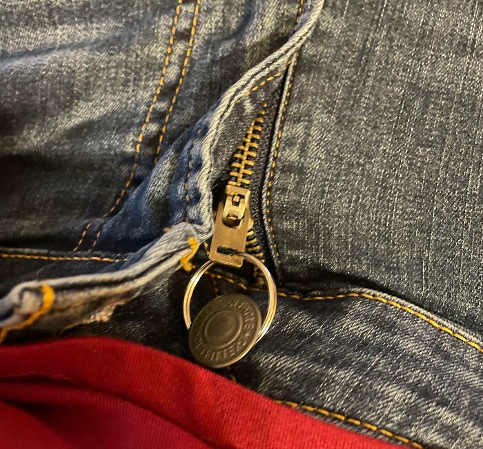 Jeans zipper pull attached to a key ring as a genius life hack for easy zipper use and repair.