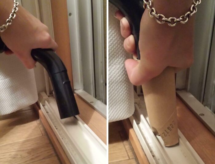 Hand using a vacuum cleaner with a cardboard tube attachment to clean narrow window track, showing genius life hacks in use.