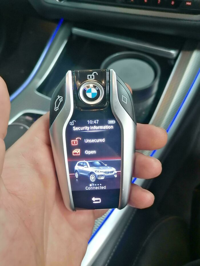 Close up of a BMW key fob showing security information screen, an example car mechanic using pics to prove issues.