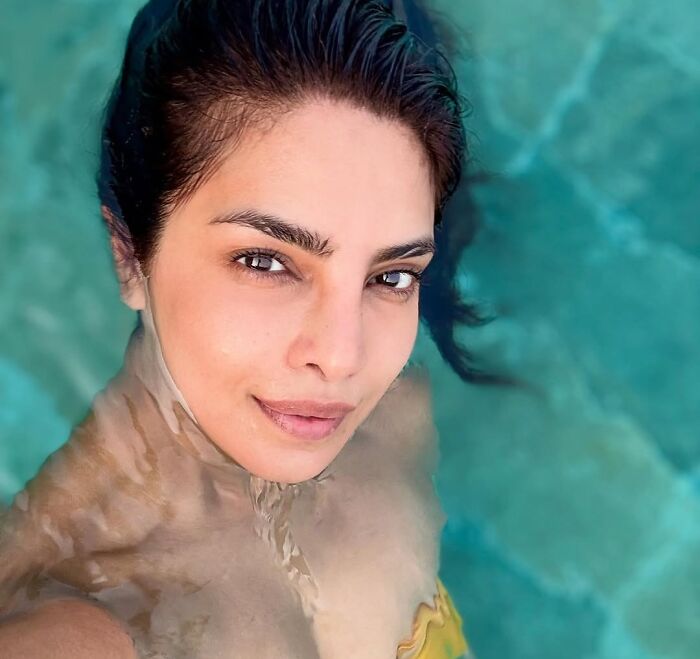 Close-up of a celebrity in a pool showcasing entitlement while talking about work and life in a candid moment.