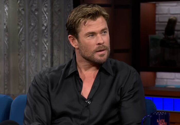 Actor discussing work and life on a talk show, illustrating celebrity entitlement in career and personal views.