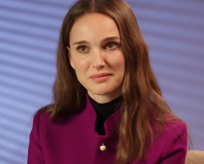 Actress in a purple jacket sharing insights on work and life, reflecting celebrity entitlement and opinions.