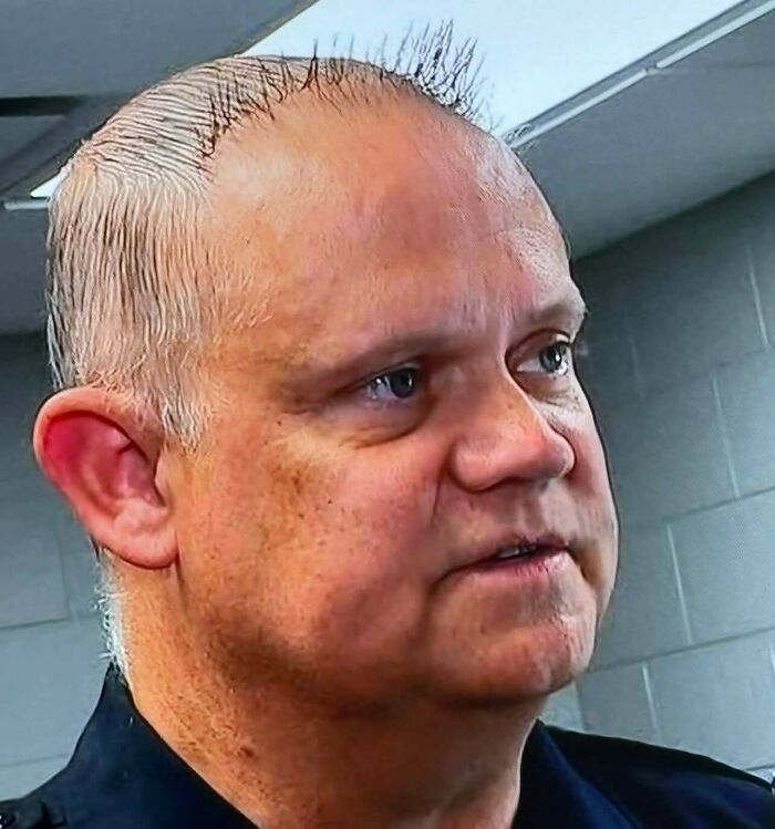 A man with a very short and spiky haircut. This is another example of unfortunate haircuts from the community.