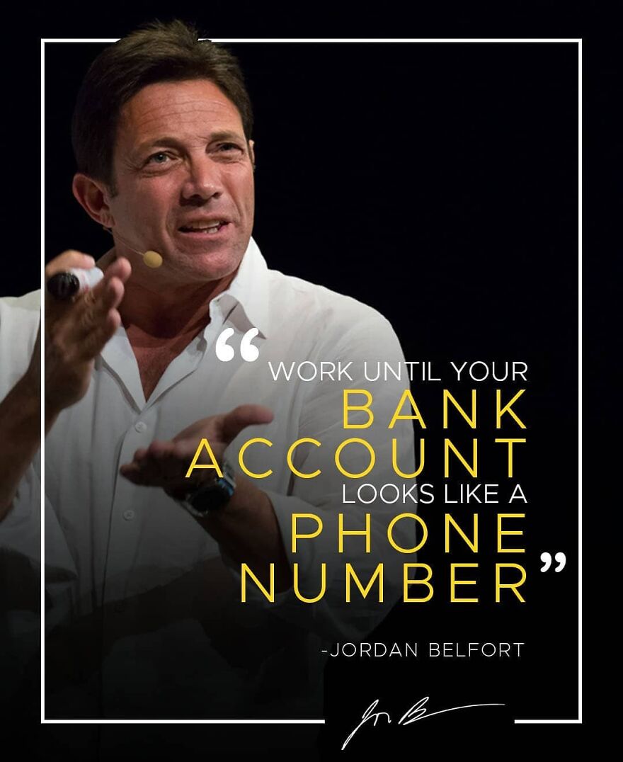 Jordan Belfort speaking on stage with a motivational quote about bank account and financial reality in 2025.