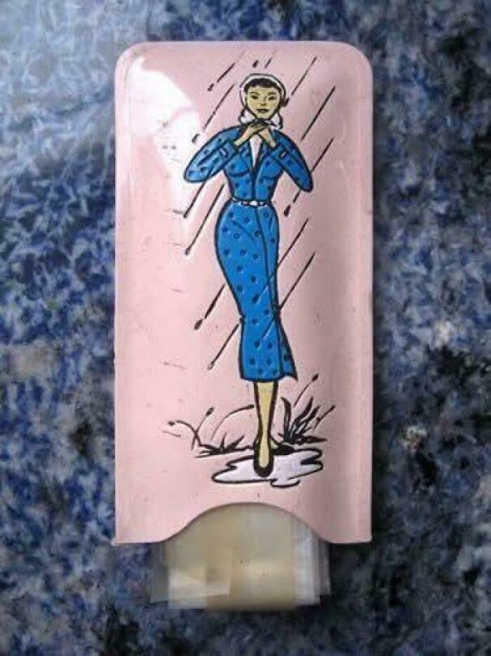 Vintage compact with illustration of a woman in blue dress, evoking nostalgia and making you feel old as heck.