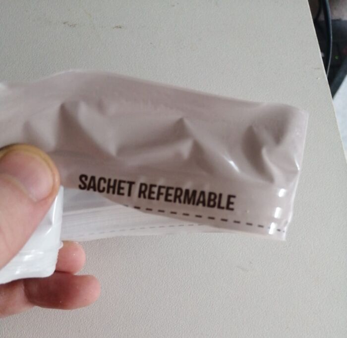 Close-up of a packaging fail showing a sachet labeled reclosable with incorrect spelling in a preventable fail photo.