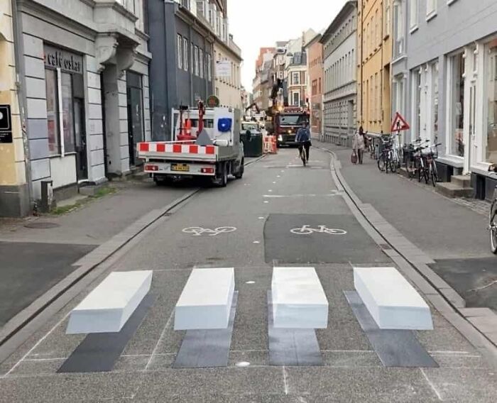 3D pedestrian crossing on a street in Denmark creating an optical illusion, showcasing Danish urban design creativity.