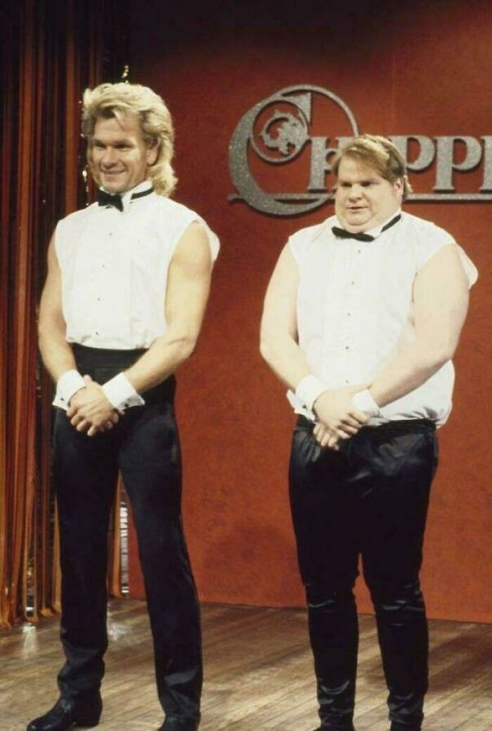 Two men wearing '90s style tuxedo vests and bow ties standing on a stage, evoking nostalgic '90s memories.