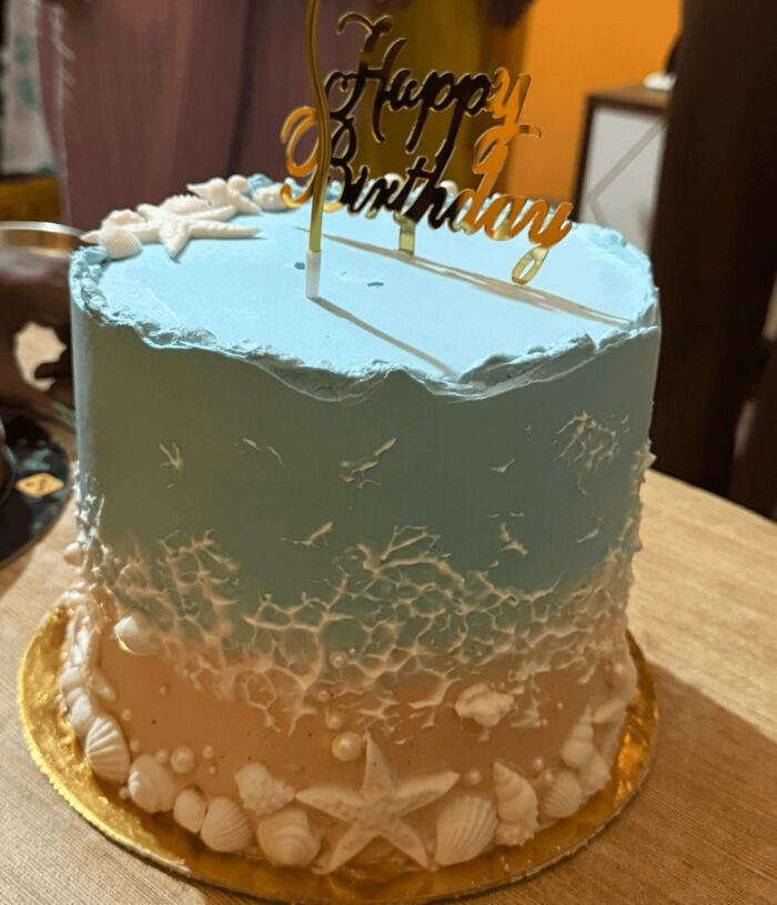 Ocean-themed birthday cake with seashell decorations showcasing gorgeous baked goods artistry and kitchen magic skills.