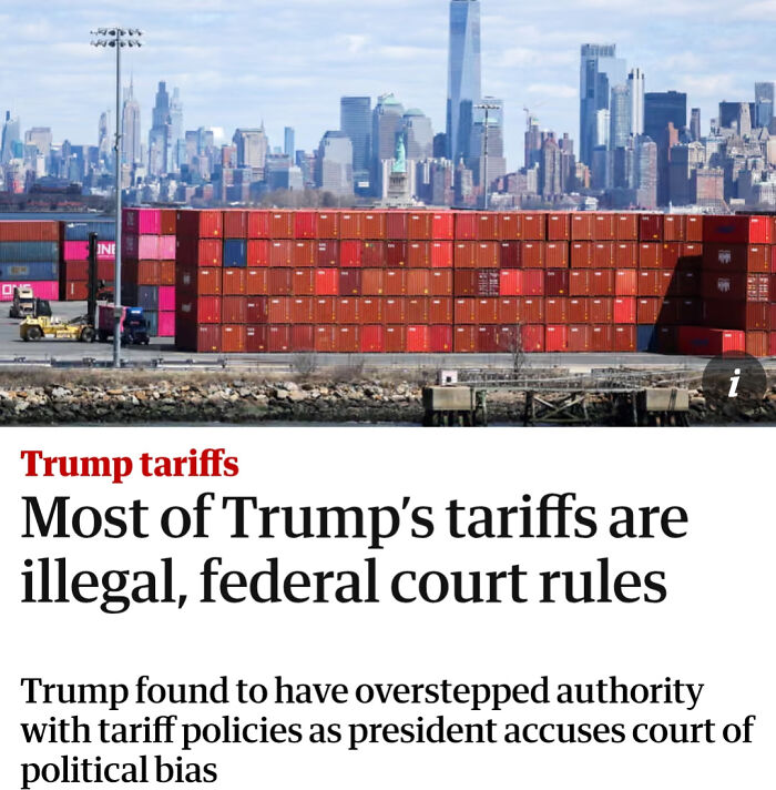 Stacked shipping containers at a port with a city skyline in the background, illustrating there was an attempt but the universe had different plans.