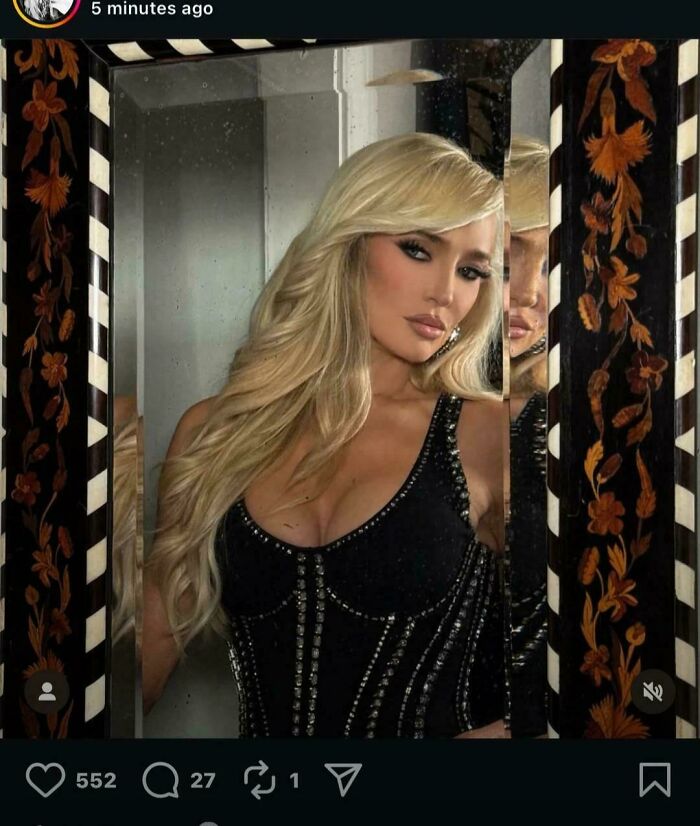 Blonde woman posing glamorously in a mirror selfie highlighting Instagram vs reality moments behind the glam.