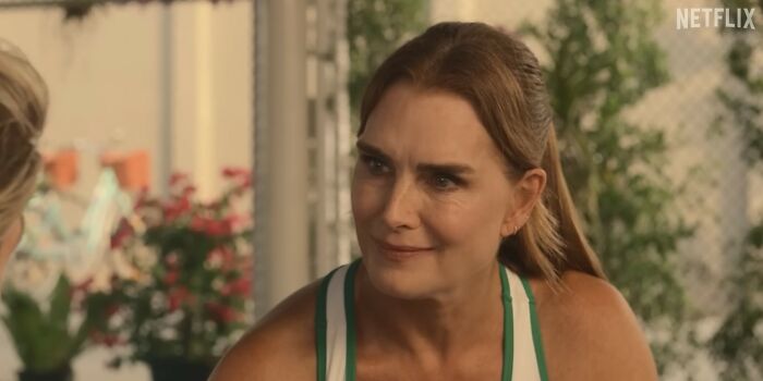 Woman in a casual setting with a concerned expression, representing Netflix movies that turned out to be letdowns.