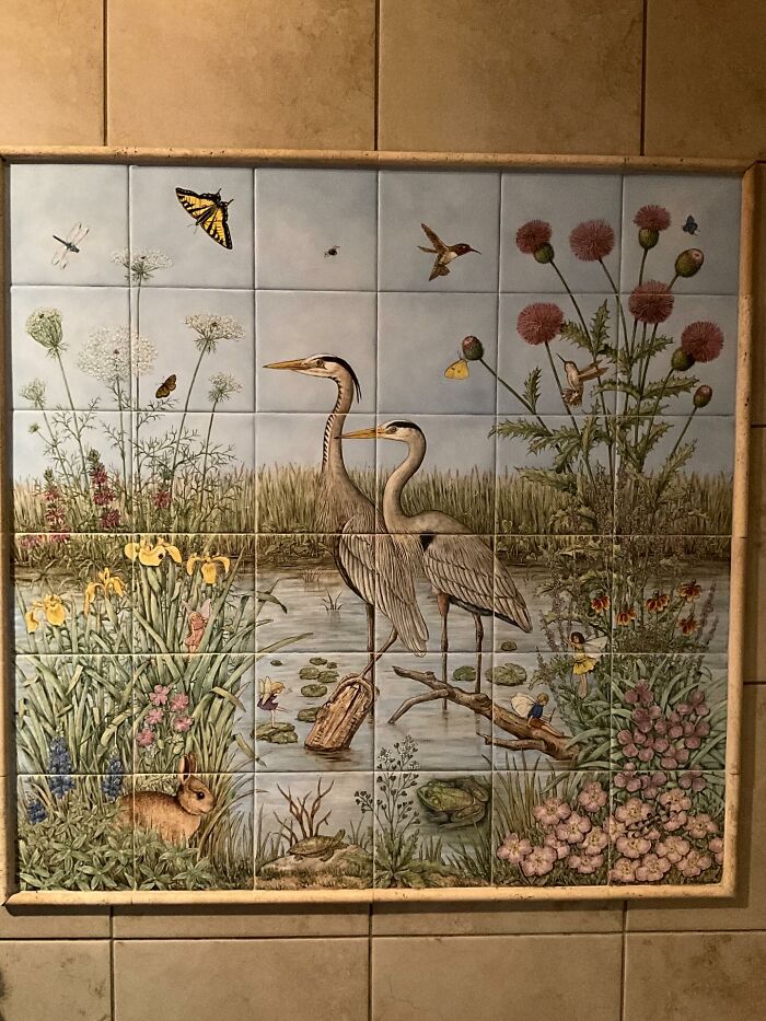 Decor piece featuring a nature scene with birds, flowers, and wildlife on ceramic tiles enhancing a home’s magical decor.