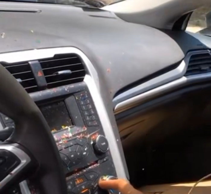 Car dashboard with salt and glitter scattered inside, showing damage caused by woman pouring salt in engine and glitter in AC.