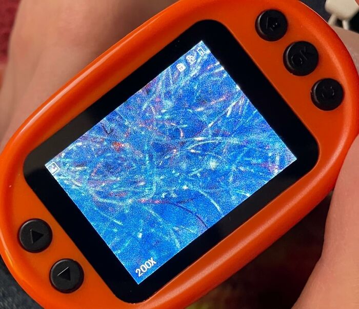 Close-up of a handheld digital microscope showing a 200x magnified image, one of the brilliant Amazon finds.