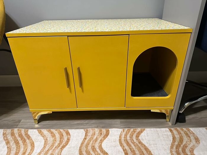 Yellow compact apartment furniture with storage cabinets and a cozy pet nook, ideal for tiny living spaces.