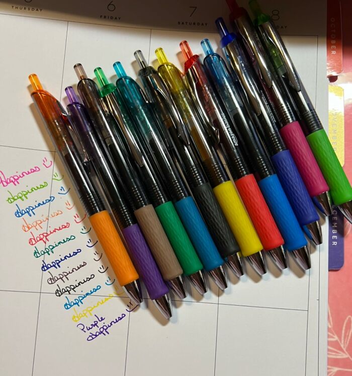 Colorful back to school pens with ink samples on a planner, perfect back to school finds for organizing and writing.