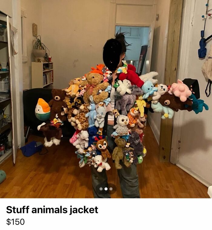 Person wearing a DIY stuff animals jacket covered in plush toys, showcasing a craft shaming project in a home setting.