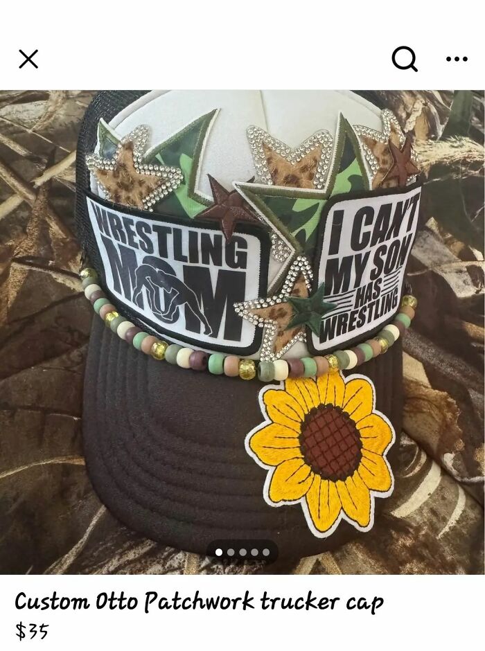 Decorated trucker cap with wrestling mom patches, bead accents, and a large sunflower patch in a DIY craft shaming style.