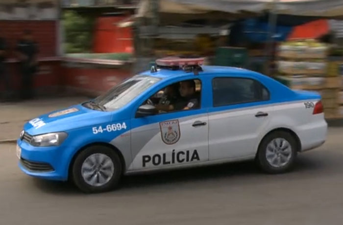 Police car on a city street responding to a very strange case involving a woman with multiple iPhones glued to her body. - 13