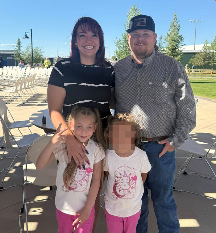 Family with two children outdoors, highlighting story of family awarded nearly a billion dollars after gravely disabled baby.