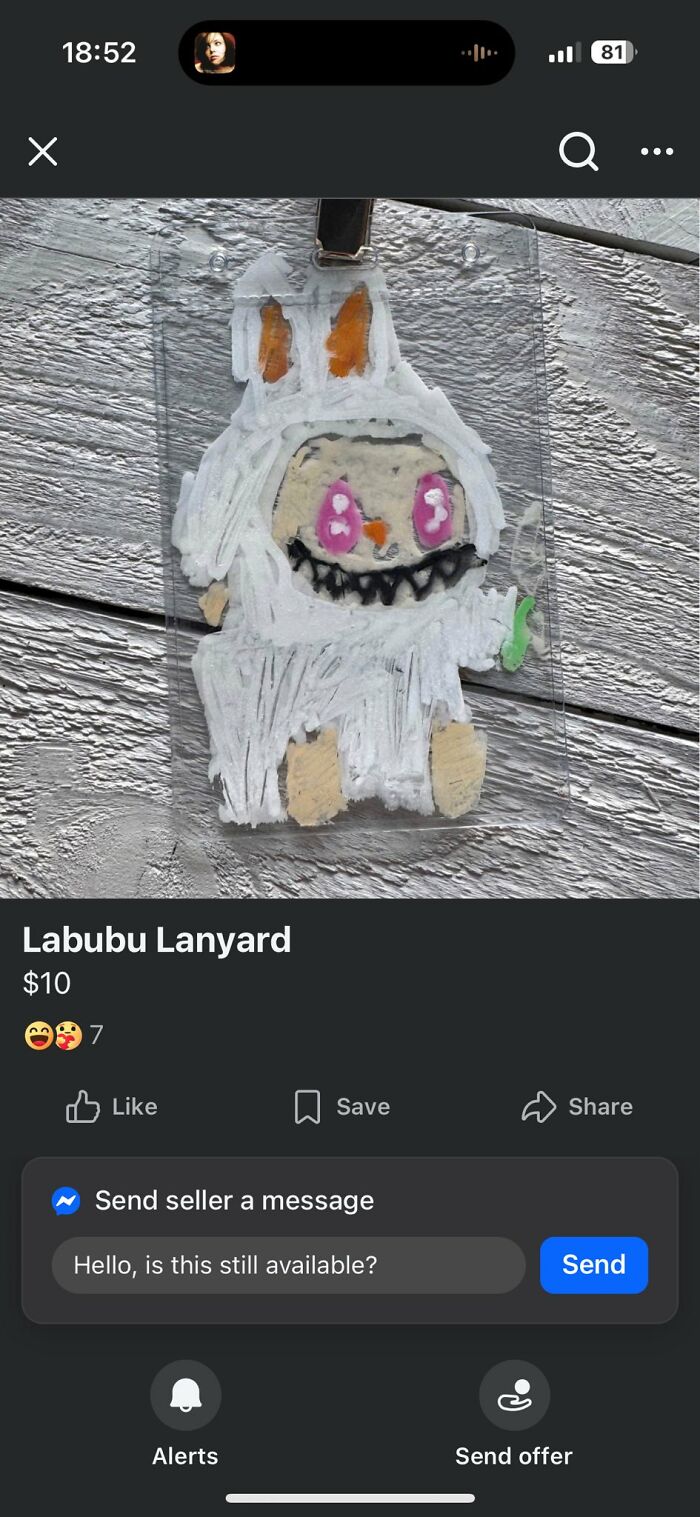 Horrendous DIY craft project of a lanyard with a poorly made character drawing in white and orange colors.