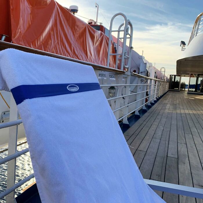 White towel on cruise ship chair on deck, one of the genius gadgets tackling dumbest problems daily.