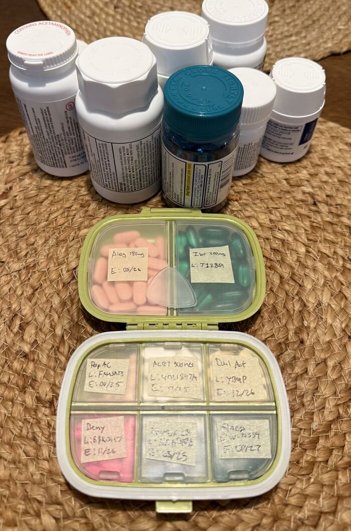 Travel finds showing organized pill containers and medication bottles for people who are chronically bad at packing.