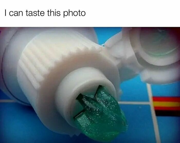 Close-up of green toothpaste from an open tube, evoking 90s kids nostalgia and memories of childhood routines.