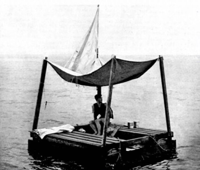 Black and white photo of a man on a makeshift raft with a sail, an unsettling image from morbid knowledge online group.