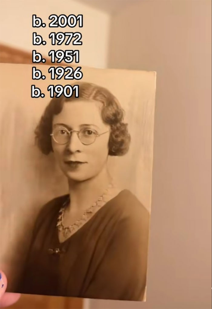 Vintage black and white photo of a woman with glasses representing family historian sharing family tree online.