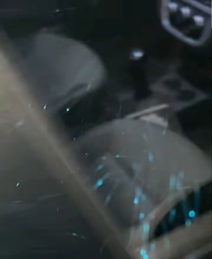 Car interior showing seats and gear shift with scattered glitter particles, related to car damage by pouring salt and glitter.