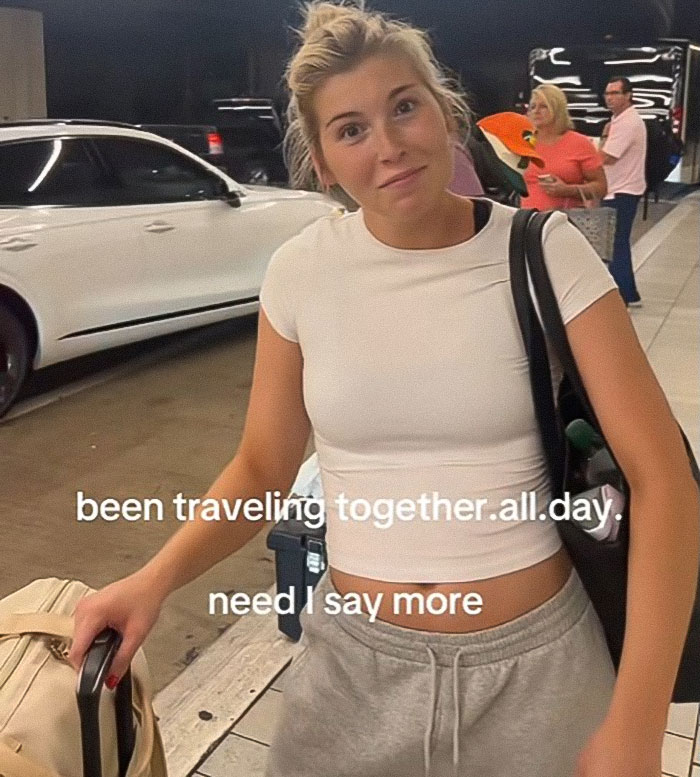 Young woman at the airport with luggage involved in a heated debate about refusing to watch her bag. Young woman at the airport with luggage involved in a heated debate about refusing to watch her bag.