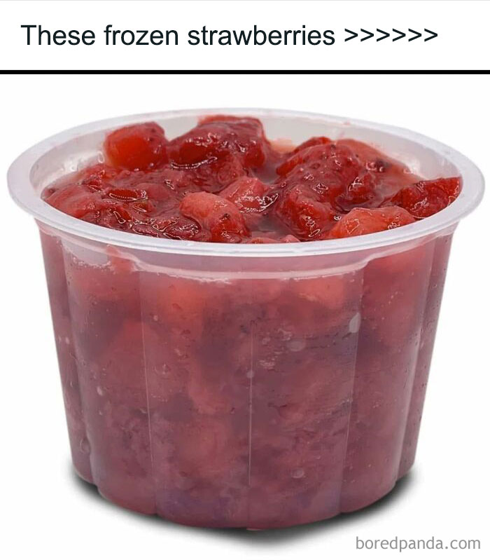 Frozen strawberries in a clear plastic cup evoking 90s kids nostalgia with classic childhood snacks and flavors.