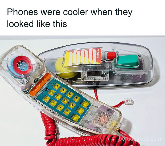 Clear vintage landline phone with transparent body and coiled red cord, evoking 90s kids nostalgia and old-school tech vibes.