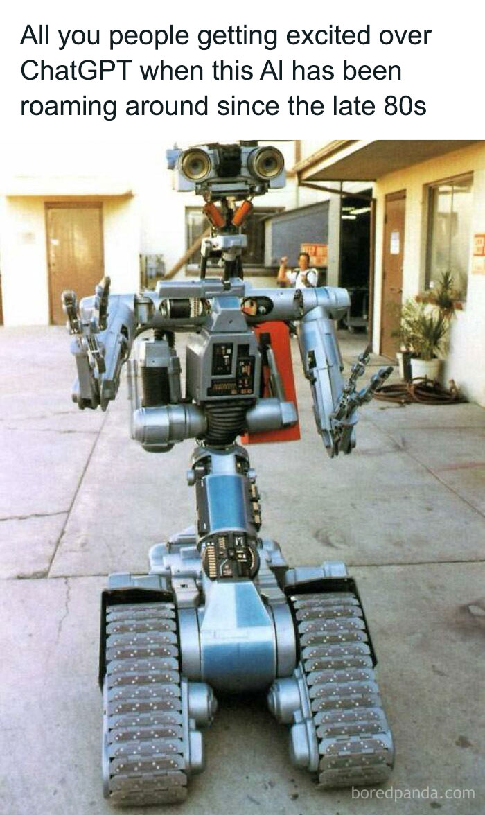 90s kids nostalgia showing a vintage robot with tank treads and mechanical arms in a courtyard setting.