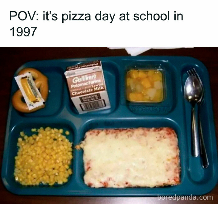 90s nostalgia school lunch tray with pizza, corn, fruit cup, pretzel, and chocolate milk from 1997 pizza day.