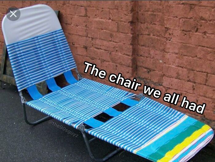 Vintage striped lawn chair against a brick wall, evoking '90s nostalgia and memories of good old times.