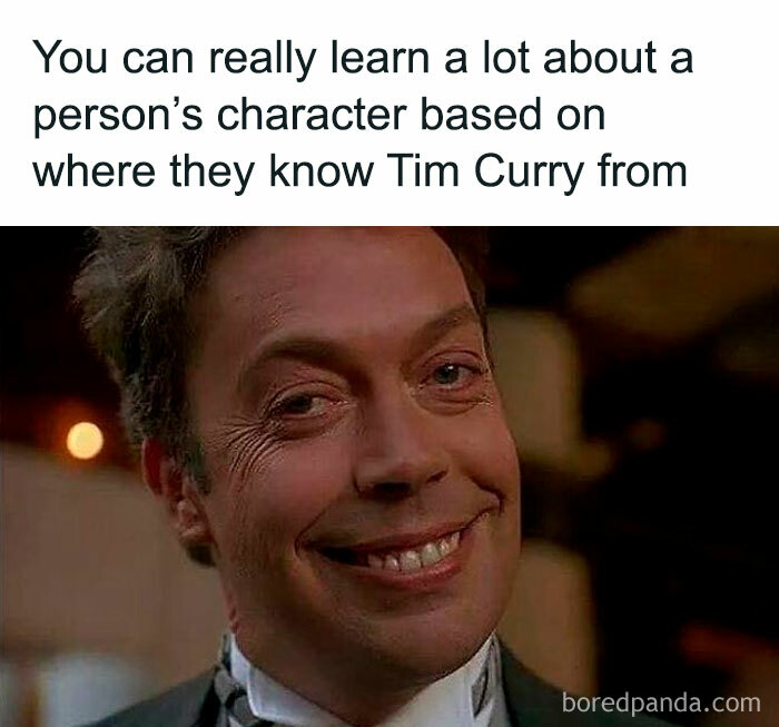 Smiling Tim Curry character close-up with text about learning character based on Tim Curry knowledge nostalgia.