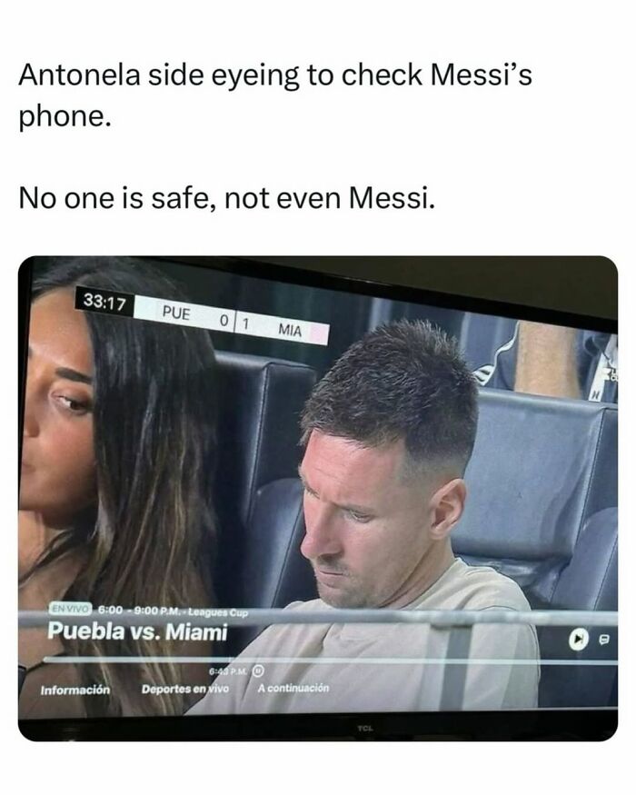 Messi focused on phone while Antonela side eyes him during Puebla vs Miami game, an entertaining meme to fight boredom.
