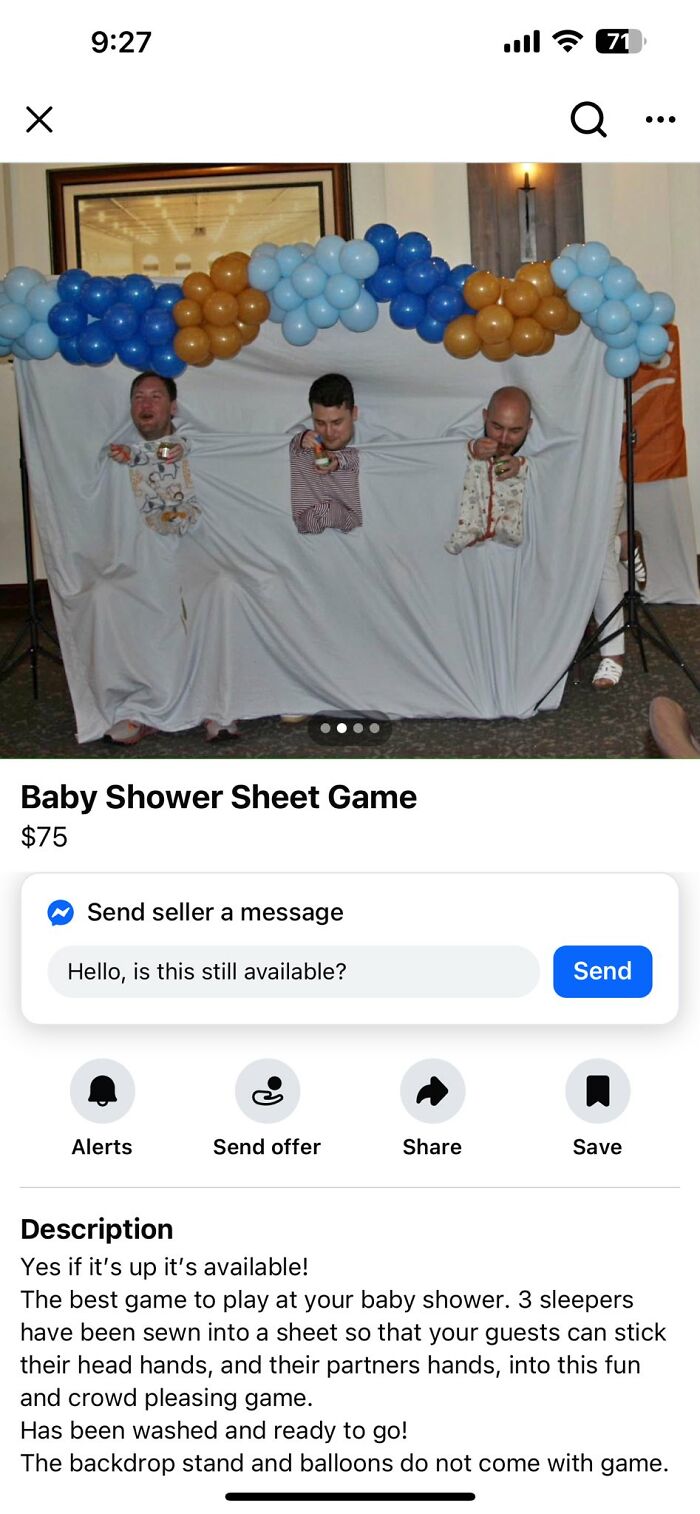 Three men’s heads and arms sticking through holes in a DIY sheet craft project for a baby shower game.