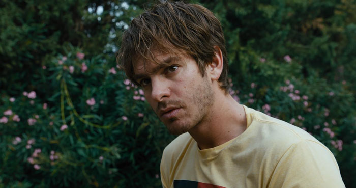 Andrew Garfield with a serious expression outdoors, highlighting his latest look causing major botox buzz.