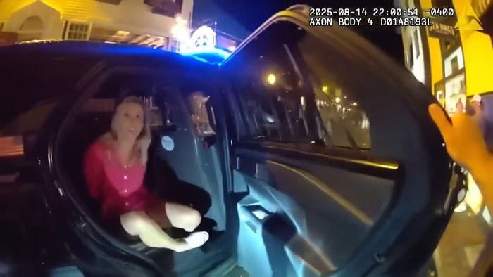 Prosecutor in viral video being arrested by cops, highlighting karma after threats during the incident at night.