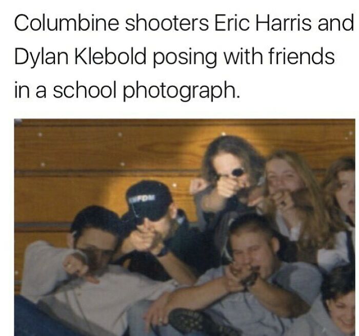 Group of young people posing with pointed fingers in a school photo, a random creepy fact from the collection.