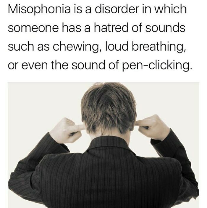 Man in black suit plugs ears illustrating misophonia, a disorder causing hatred of sounds like chewing and pen-clicking.