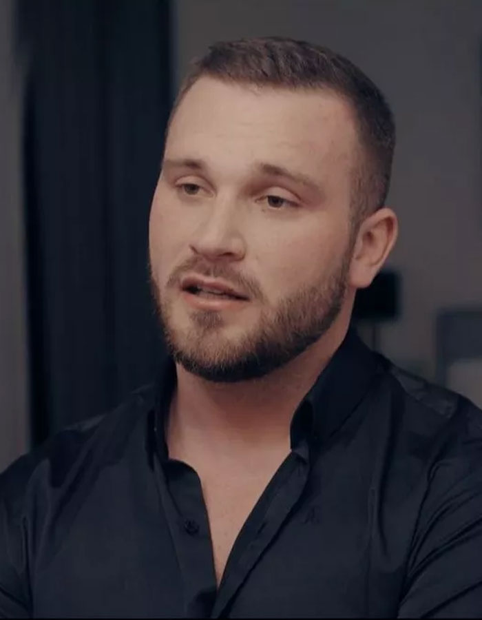 Man with beard and short hair speaking in an interview about Bonnie Blue&rsquo;s career in a new documentary.