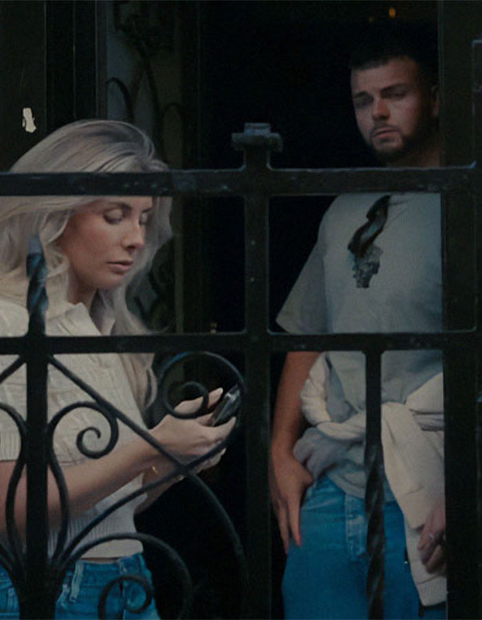 Bonnie Blue&rsquo;s ex-husband speaks out about her career in a new documentary, standing behind a black wrought iron gate.