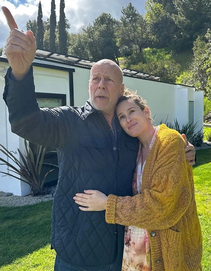 Bruce Willis and his wife sharing a tender moment outside their family home amid health update and move. Bruce Willis and his wife sharing a tender moment outside their family home amid health update and move.