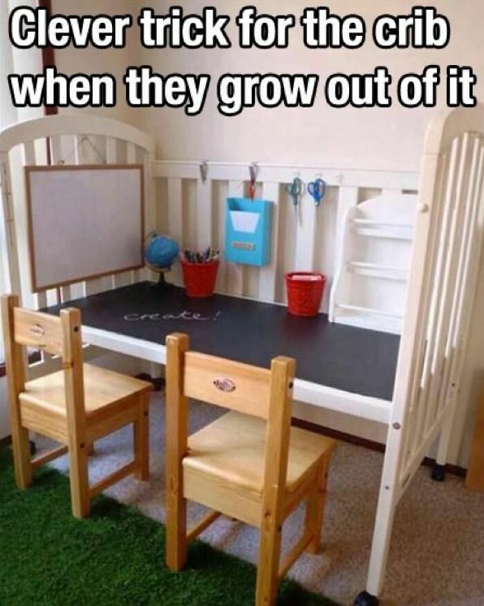 Child's crib converted into a creative craft workspace with chalkboard surface, small chairs, and organized crafty supplies.